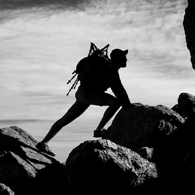 Hiker on a mountain trail, representing personal growth and shifting perspective